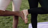 Young women doing fitness outdoors together